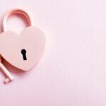 Photo of a Pink Heart Shaped Padlock and a Key