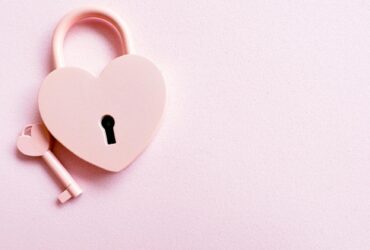 Photo of a Pink Heart Shaped Padlock and a Key